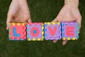 Puzzle wording love has hold on hand background