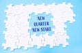 A puzzle with the words New Quarter New Start written in the middle Royalty Free Stock Photo