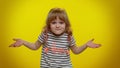 Puzzled clueless uncertain blonde kid child raising hands in helpless gesture, difficult question Royalty Free Stock Photo