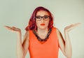 Puzzled, clueless woman.wear glasses.looking at you Royalty Free Stock Photo