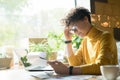 Puzzled lady reading online article on tablet Royalty Free Stock Photo