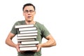 Puzzled male student showing pile of books Royalty Free Stock Photo