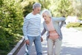 Puzzled pensioner caring about senior wife outdoors