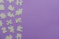 Puzzles on a purple background as a symbol of autism. Conceptual vision of the problem of autistic children