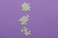 Puzzles on a purple background as a symbol of autism. Conceptual vision of the problem of autistic children