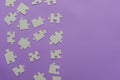 Puzzles on a purple background as a symbol of autism. Conceptual vision of the problem of autistic children