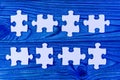 Puzzles on a wooden background in blue. business vision. Royalty Free Stock Photo