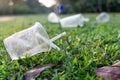 PVC cups litter on public park pose danger to environment Royalty Free Stock Photo