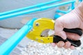 PVC pipe cutting by hand Royalty Free Stock Photo