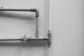 PVC pipes that protruded from the cement wall caused by the water system inside the house Royalty Free Stock Photo