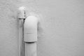 PVC pipes that protruded from the cement wall caused by the water system inside the house Royalty Free Stock Photo