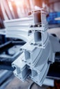 PVC window profile cut. Colored background. Details industrial equipment. Royalty Free Stock Photo