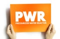 PWR - Pressurized Water Reactor acronym on card, abbreviation concept background
