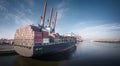 Aerial view of a container ship in the port of Hamburg at a terminal in sunny weather Royalty Free Stock Photo