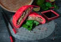 Pyansho steamed bun. Filled with beef, cabbage and onions. Cut in half lies on rice paper. Garnished with spices and parsley. In Royalty Free Stock Photo