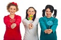 Pyjamas women giving colorful lollipops