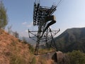 The pylon of the cableway that connects the towns of Albino and Selvino. Green painted pylons to camouflage them in the woods Royalty Free Stock Photo