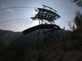 The pylon of the cableway that connects the towns of Albino and Selvino. Green painted pylons to camouflage them in the woods Royalty Free Stock Photo