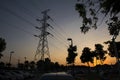 Pylon and power lines at sunset Royalty Free Stock Photo