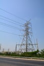 Pylon and power lines at sunset Royalty Free Stock Photo