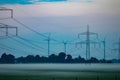 Pylon and transmission power line in sunset Royalty Free Stock Photo