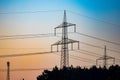 Pylon and transmission power line in sunset Royalty Free Stock Photo