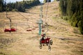 Pylypets, Ukraine - 15 September, 2019: Mountain bikers on chair lift in mountain. Carpathians, Ukraine