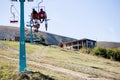 Pylypets, Ukraine - 15 September, 2019: Mountain bikers on chair lift in mountain. Carpathians, Ukraine