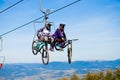 Pylypets, Ukraine - 15 September, 2019: Mountain bikers on chair lift in mountain. Carpathians, Ukraine