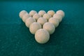 A pyramid of billiard balls on a green cloth Royalty Free Stock Photo