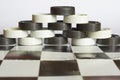 Pyramid checkers on chessboard Royalty Free Stock Photo