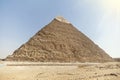 Pyramid of Chephren on a blue sky background. Great Pyramids of Giza in the desert. second pyramid Royalty Free Stock Photo