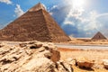 The Pyramid of Chephren, the Pyramid of Menkaure, view from the road in the desert Royalty Free Stock Photo