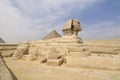 The pyramid of Chephren with a statue of a sphinx in the foreground Royalty Free Stock Photo