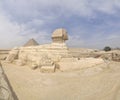 The pyramid of Chephren with a statue of a sphinx in the foreground Royalty Free Stock Photo