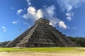 The pyramid of Chichen Itza in honor of the God Kukulkan the feathered serpent under a beautiful tropical blue sky Royalty Free Stock Photo