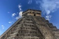 The pyramid of Chichen Itza in honor of the God Kukulkan under a beautiful tropical blue sky Royalty Free Stock Photo