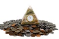 Pyramid clock and coins Royalty Free Stock Photo