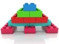 Pyramid of colored toy bricks on white Royalty Free Stock Photo