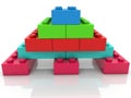 Pyramid of colored toy bricks on white Royalty Free Stock Photo