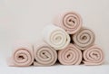 A pyramid of colorful cotton plaids rests on the table.