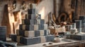 Pyramid of concrete bricks wrapped in jute on workshop table with tools in background Royalty Free Stock Photo
