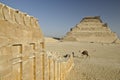 Pyramid of Djoser and Temple Wall with Cobras in Saqqara Royalty Free Stock Photo