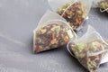 Pyramid in herbal tea bags hibiscus, fruit pieces close up Royalty Free Stock Photo