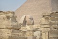 The pyramid of Khafre or of Chephren with a statue of a sphinx in the foreground Royalty Free Stock Photo
