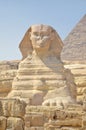 The pyramid of Khafre or of Chephren with a statue of a sphinx in the foreground Royalty Free Stock Photo