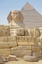 The pyramid of Khafre or of Chephren with a statue of a sphinx in the foreground Royalty Free Stock Photo