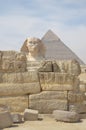 The pyramid of Khafre or of Chephren with a statue of a sphinx in the foreground Royalty Free Stock Photo