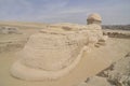 The pyramid of Chephren with a statue of a sphinx in the foreground Royalty Free Stock Photo