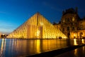 Pyramid of Louvre museum at night in Paris  France Royalty Free Stock Photo